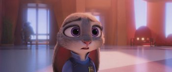Movie still from “Zootopia” (2016), directed by Jared Bush – A cartoon rabbit is looking at the camera; Close Up shot, Over the shoulder angle
