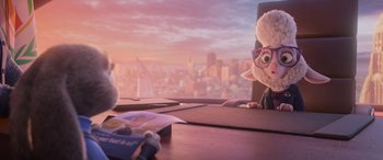 Movie still from “Zootopia” (2016), directed by Jared Bush – A stuffed animal sitting at a desk in front of a window; Medium shot, Over the shoulder angle