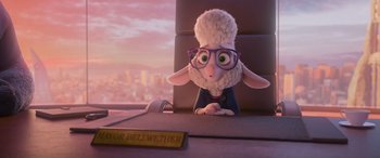 Movie still from “Zootopia” (2016), directed by Jared Bush – A stuffed sheep sitting on top of a window sill; Medium shot, Over the shoulder angle