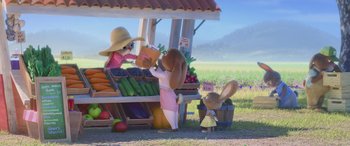 Movie still from “Zootopia” (2016), directed by Jared Bush – A couple of rabbits standing next to each other in front of a fruit stand; Wide shot, Over the shoulder angle