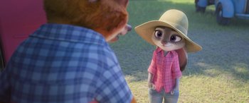 Movie still from “Zootopia” (2016), directed by Jared Bush – A person standing next to an animal wearing a hat; Close Up shot, Over the shoulder angle