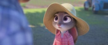 Movie still from “Zootopia” (2016), directed by Jared Bush – A bunny wearing a hat and a pink shirt; Close Up shot, Over the shoulder angle