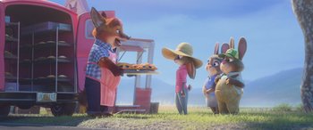 Movie still from “Zootopia” (2016), directed by Jared Bush – A group of people that are standing in the grass; Wide shot, Over the shoulder angle