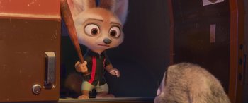 Movie still from “Zootopia” (2016), directed by Jared Bush – A cartoon character holding a baseball bat in front of a mirror; Medium shot, Over the shoulder angle
