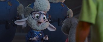 Movie still from “Zootopia” (2016), directed by Jared Bush – A stuffed animal wearing glasses and a blue jacket; Close Up shot, Over the shoulder angle