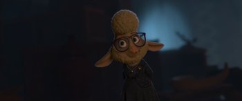 Movie still from “Zootopia” (2016), directed by Jared Bush – A sheep wearing glasses and wearing a sweater; Close Up shot, Over the shoulder angle