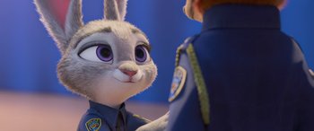Movie still from “Zootopia” (2016), directed by Jared Bush – A stuffed rabbit in a police uniform; Close Up shot, Over the shoulder angle