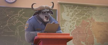 Movie still from “Zootopia” (2016), directed by Jared Bush – An animal that is sitting at a desk; Medium shot, Over the shoulder angle
