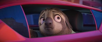 Movie still from “Zootopia” (2016), directed by Jared Bush – The head and face of an animal in a car; Close Up shot, Over the shoulder angle