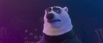 Movie still from “Zootopia” (2016), directed by Jared Bush – A white polar bear wearing a black and white outfit; Close Up shot, Low angle