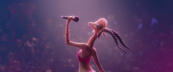 Movie still from “Zootopia” (2016), directed by Jared Bush – An animated woman holding a microphone up to her head; Close Up shot, Over the shoulder angle
