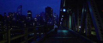 Movie still from “1990: The Bronx Warriors” (1982), directed by Enzo G. Castellari – A person walking on a bridge at night; Extreme Wide shot, High angle