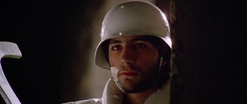 Movie still from “1990: The Bronx Warriors” (1982), directed by Enzo G. Castellari – A person wearing a helmet; Close Up shot, Low angle