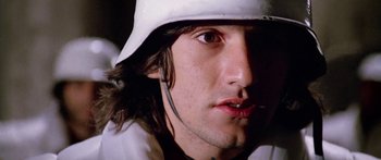 Movie still from “1990: The Bronx Warriors” (1982), directed by Enzo G. Castellari – A person wearing a hat; Close Up shot, Low angle