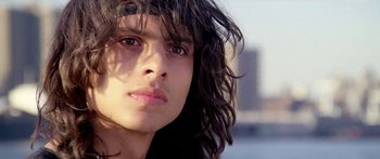 Movie still from “1990: The Bronx Warriors” (1982), directed by Enzo G. Castellari – A person with long black hair; Close Up shot, Low angle