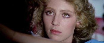 Movie still from “1990: The Bronx Warriors” (1982), directed by Enzo G. Castellari – A woman's face with brown eyes; Close Up shot, Over the shoulder angle