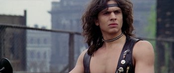 Movie still from “1990: The Bronx Warriors” (1982), directed by Enzo G. Castellari – A person with long hair; Close Up shot, Low angle