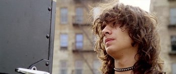 Movie still from “1990: The Bronx Warriors” (1982), directed by Enzo G. Castellari – A person with long curly hair; Close Up shot, Low angle