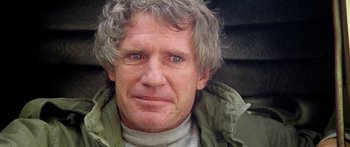 Movie still from “1990: The Bronx Warriors” (1982), directed by Enzo G. Castellari – A person with grey hair; Close Up shot, Low angle