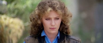 Movie still from “1990: The Bronx Warriors” (1982), directed by Enzo G. Castellari – A person wearing a jacket; Close Up shot, Over the shoulder angle