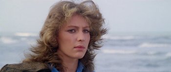 Movie still from “1990: The Bronx Warriors” (1982), directed by Enzo G. Castellari – A young woman with long , blonde hair stares into the distance; Close Up shot, Low angle