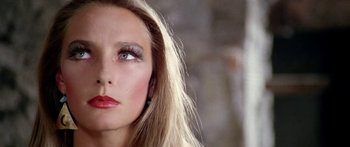 Movie still from “1990: The Bronx Warriors” (1982), directed by Enzo G. Castellari – A person with long blonde hair; Close Up shot, Low angle