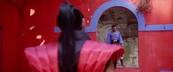 Movie still from “1990: The Bronx Warriors” (1982), directed by Enzo G. Castellari – A man and a woman are standing in front of each other; Medium shot, Over the shoulder angle
