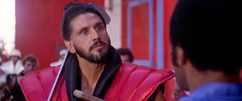 Movie still from “1990: The Bronx Warriors” (1982), directed by Enzo G. Castellari – A person holding a wooden stick; Close Up shot, Low angle