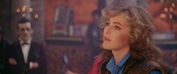 Movie still from “1990: The Bronx Warriors” (1982), directed by Enzo G. Castellari – A person wearing a blue shirt; Close Up shot, Over the shoulder angle