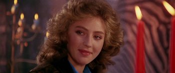 Movie still from “1990: The Bronx Warriors” (1982), directed by Enzo G. Castellari – A person wearing a suit and tie; Close Up shot, Over the shoulder angle