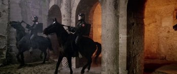 Movie still from “1990: The Bronx Warriors” (1982), directed by Enzo G. Castellari – A man riding a horse through a tunnel; Wide shot, Low angle