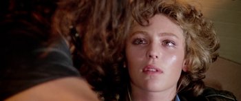 Movie still from “1990: The Bronx Warriors” (1982), directed by Enzo G. Castellari – A woman's face as she looks into the distance; Close Up shot, Over the shoulder angle