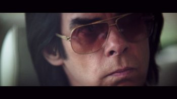 Movie still from “20,000 Days on Earth” (2014), directed by Iain Forsyth – A person wearing sunglasses; Extreme Close Up shot, Low angle