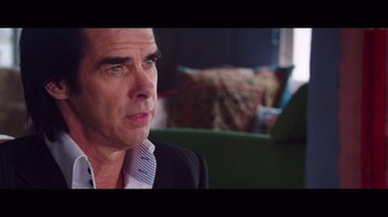 Movie still from “20,000 Days on Earth” (2014), directed by Iain Forsyth – A person sitting in a room; Close Up shot, Over the shoulder angle