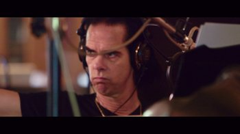 Movie still from “20,000 Days on Earth” (2014), directed by Iain Forsyth – A person wearing headphones; Close Up shot, High angle