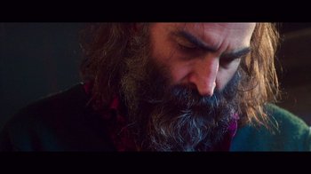 Movie still from “20,000 Days on Earth” (2014), directed by Iain Forsyth – A man with a long beard is looking at the camera; Extreme Close Up shot, Low angle
