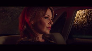 Movie still from “20,000 Days on Earth” (2014), directed by Iain Forsyth – A person sitting in a car; Close Up shot, Over the shoulder angle
