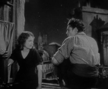 Movie still from “7th Heaven” (1927), directed by Frank Borzage – A man and a woman sitting on a bench; Medium shot, Low angle