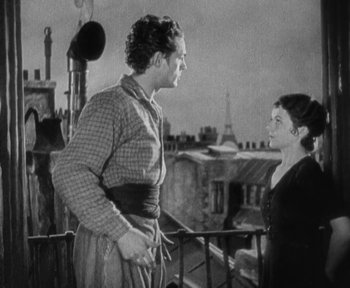 Movie still from “7th Heaven” (1927), directed by Frank Borzage – A man and a woman standing next to each other on a balcony; Medium shot, Low angle