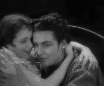 Movie still from “7th Heaven” (1927), directed by Frank Borzage – A man and a woman embracing each other; Close Up shot, High angle