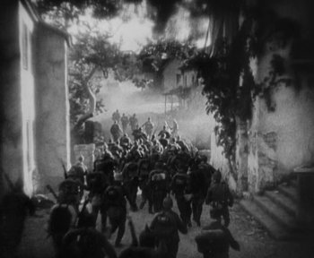 Movie still from “7th Heaven” (1927), directed by Frank Borzage – A group of soldiers are walking through a tunnel; Extreme Wide shot, High angle