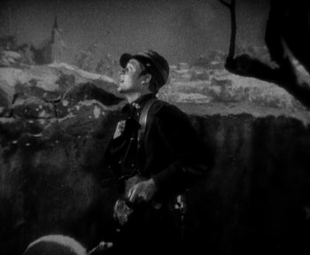 Movie still from “7th Heaven” (1927), directed by Frank Borzage – An old photo of a man smoking a pipe; Medium shot, Low angle