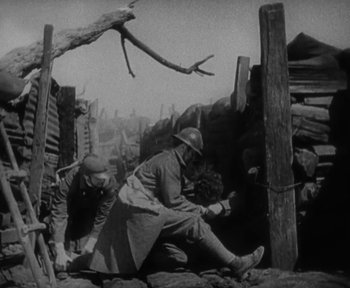 Movie still from “7th Heaven” (1927), directed by Frank Borzage – Two men in uniforms working on a wooden structure; Medium shot, Low angle