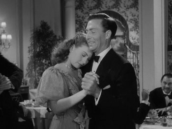 Movie still from “A Letter to Three Wives” (1949), directed by Joseph L. Mankiewicz – A man and a woman are dancing in a restaurant; Medium shot, Low angle
