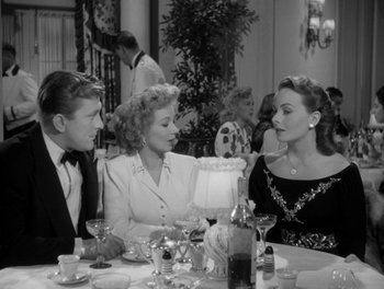 Movie still from “A Letter to Three Wives” (1949), directed by Joseph L. Mankiewicz – A group of people sitting around a table; Medium shot, High angle
