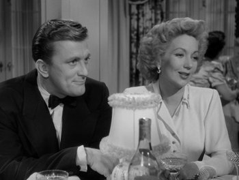 Movie still from “A Letter to Three Wives” (1949), directed by Joseph L. Mankiewicz – A man and a woman sitting at a dinner table; Medium shot, Over the shoulder angle