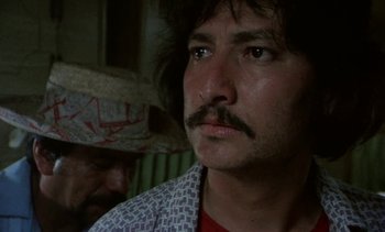 Movie still from “Alambrista!” (1977), directed by Robert M. Young – A person with a mustache; Close Up shot, Low angle