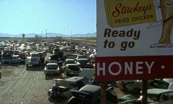 Movie still from “Alambrista!” (1977), directed by Robert M. Young – A bunch of cars that are in the street; Extreme Wide shot, High angle