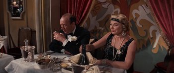 Movie still from “Anastasia” (1956), directed by Anatole Litvak – A man and a woman sitting at a dinner table; Medium shot, Over the shoulder angle