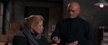 Movie still from “Anastasia” (1956), directed by Anatole Litvak – A man and a woman are looking at each other; Medium shot, Over the shoulder angle